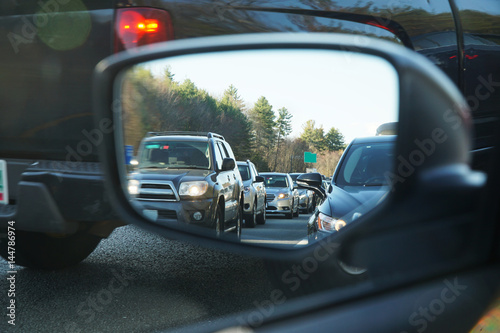 vehicles in a row during traffic jam from car mirror