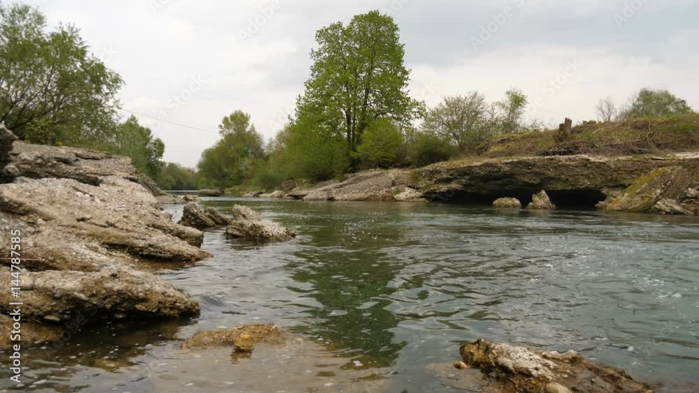 Floating Water of a river in spring in 4K