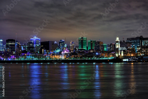 Beautiful view of downtown Montreal during evening in reflection in St Lawrence river in Montreal, Canada
