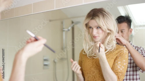  Transvestite man getting ready shares a kiss with his partner