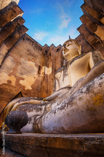 Seated Buddha image at  Wat Si Chum temple in Sukhothai Historical Park  a UNESCO world heritage site  Thailand