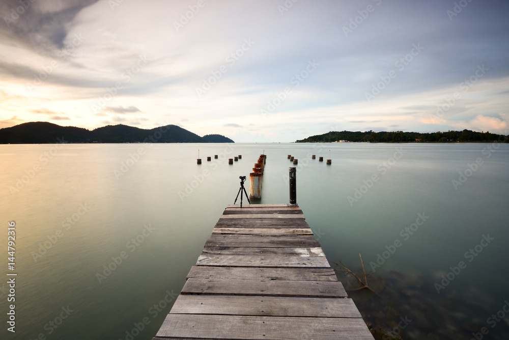 Long exposure shot of old pier at seascape