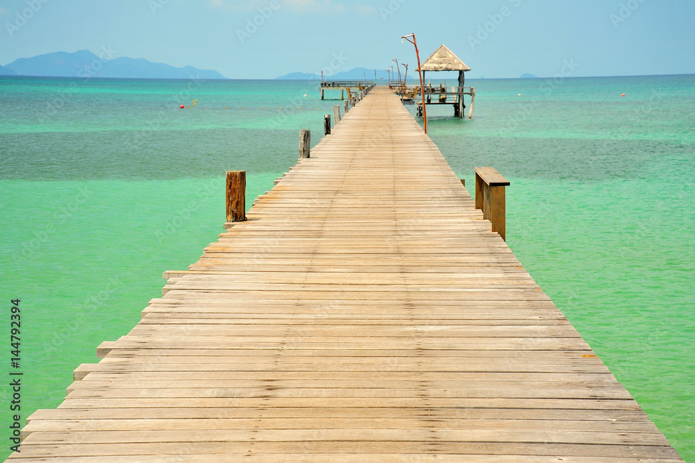 Beach on Tropical Islands with Wooden Piers