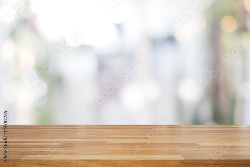 Empty wooden table and blurred white nature background,