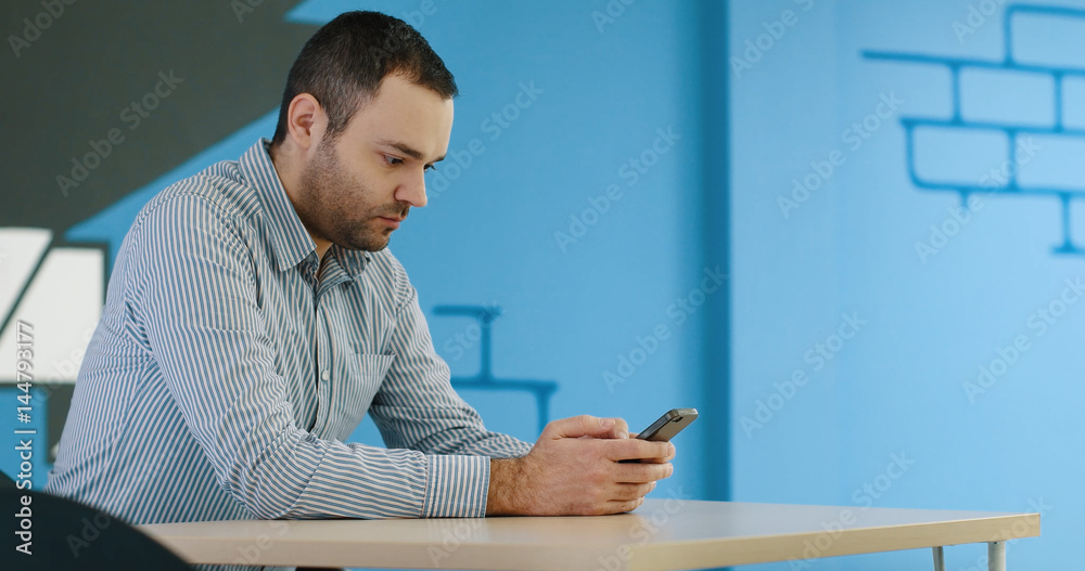 Senior businessman  using cell phone at  stratup office