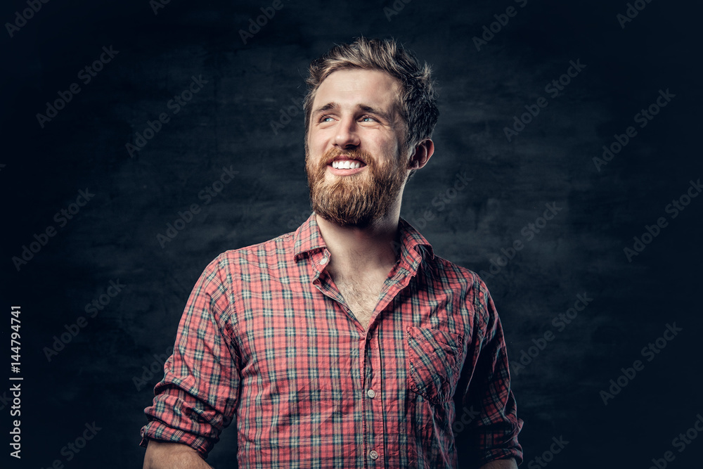 Bearded male dressed in a red fleece shirt makes conversation. Bearded male dressed in a red fleece shirt makes conversation.