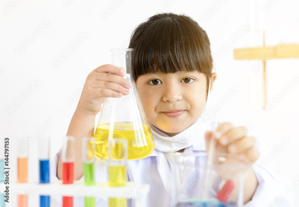 Asian child playing scientist with colorful lab tubes Asian child playing scientist with colorful lab tubes