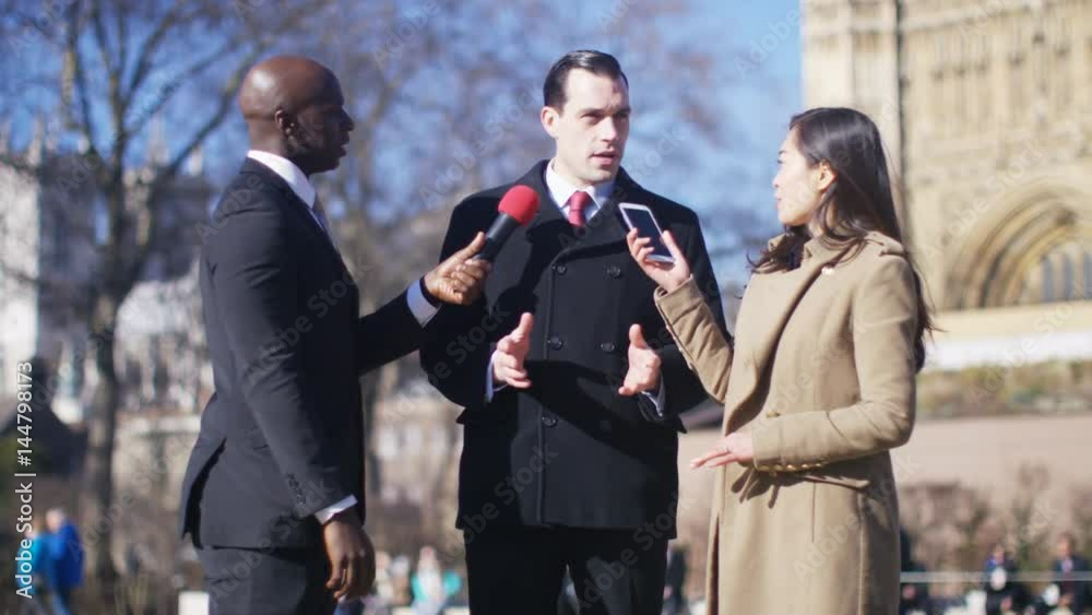 Businessman or politician giving live interview to reporters in London Businessman or politician giving live interview to reporters in London