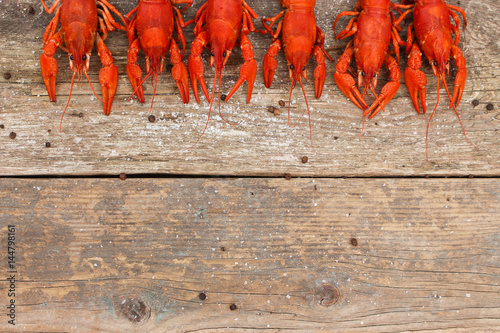 Crawfish on the old wooden background. 