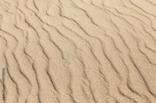 Waves in the sand, nature background. © jeffcampbell