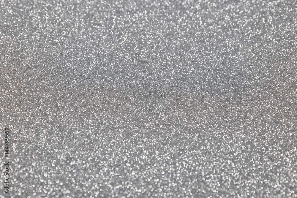 Silver glitter background. Abstract shiny texture.
