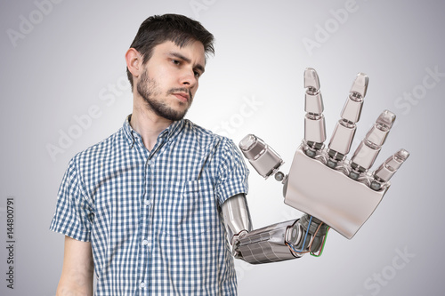 Young man with robotic hand as a replacement for his hand. 3D rendered illustration of hand.