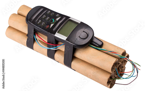 Bomb with mobile phone. Explosion terrorists with a detonator phone. Red and blue wire for bomb neutralization. photo