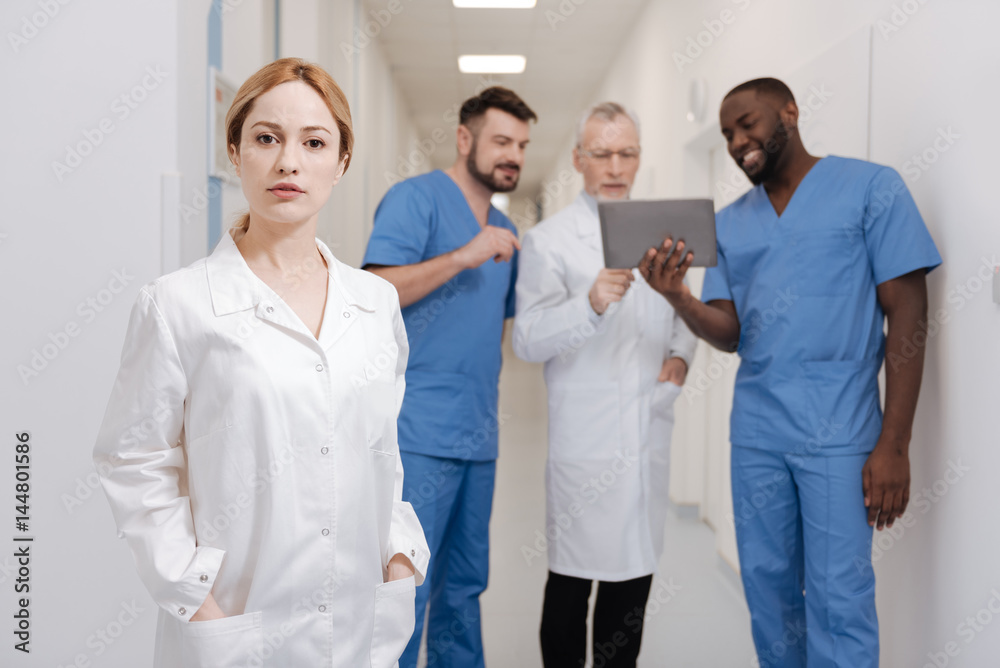 Young female doctor standing in the hospital Young female doctor standing in the hospital