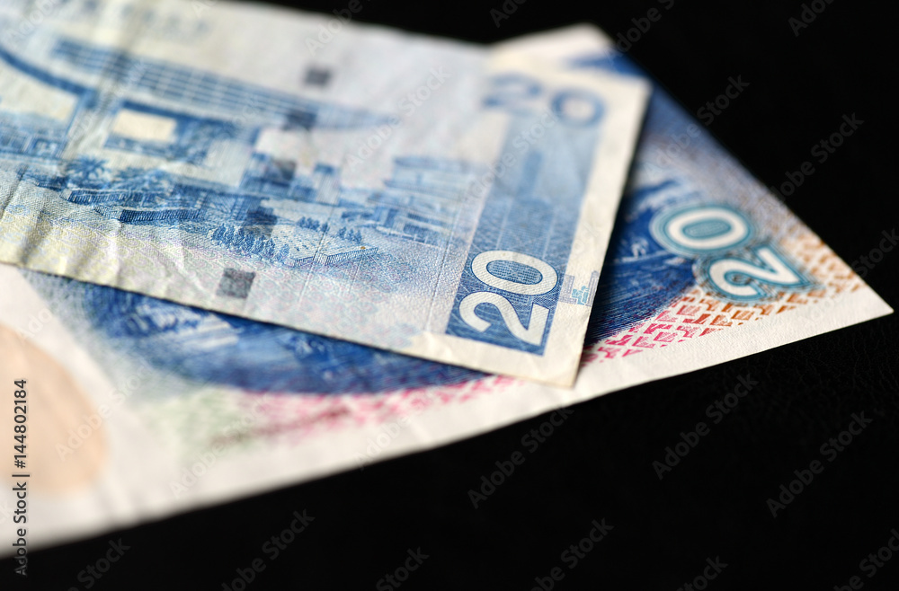 Two bills of twenty Hong Kong dollars on a dark background Two bills of twenty Hong Kong dollars on a dark background