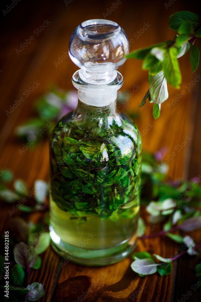 Mint syrup in a glass bottle Mint syrup in a glass bottle