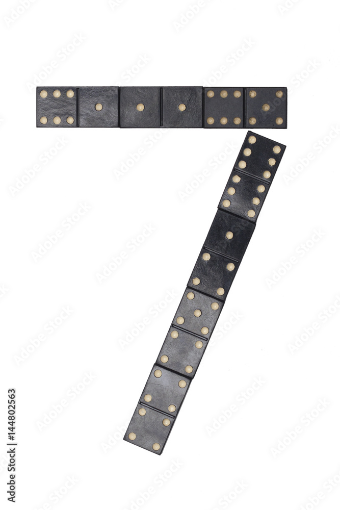 number seven made of black dominoes tiles number seven made of black dominoes tiles