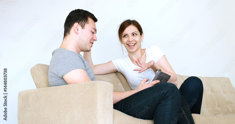 Young Couple using digital tablet at home Young Couple using digital tablet at home