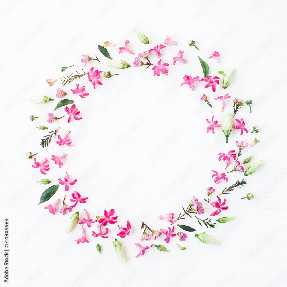 Flowers composition. Wreath made of various pink flowers on white background. Flat lay, top view