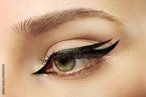 Beautiful makeup with eyeliner, closeup photo