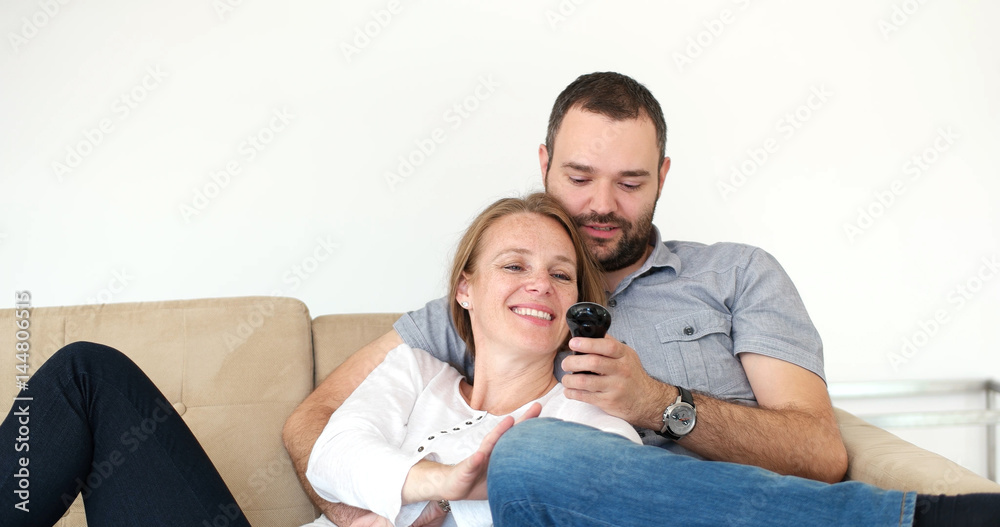 senoior couple watching tv in modern villa senoior couple watching tv in modern villa