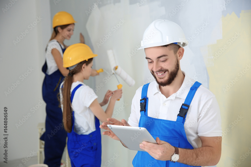 Young decorators renewing apartment Young decorators renewing apartment