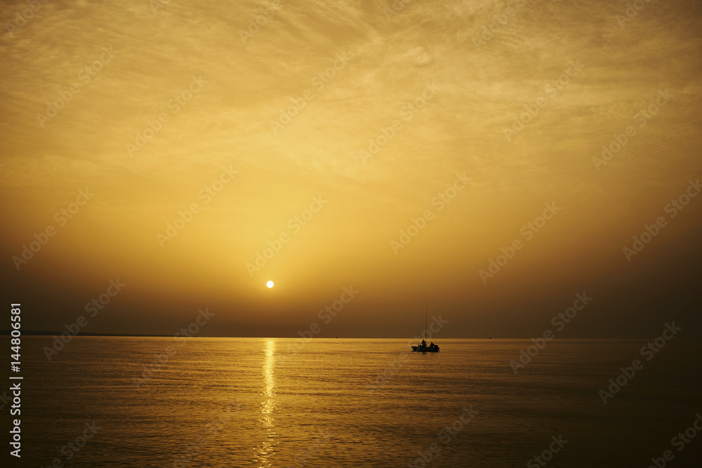 fishermen on sunset