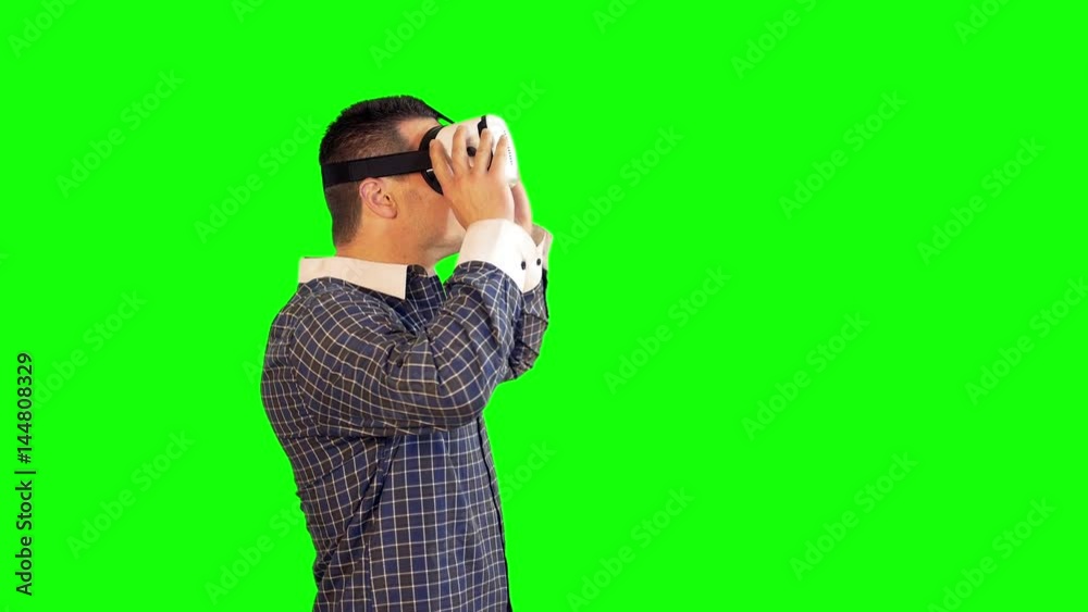 Greenscreen Virtual Reality Side View of Man Following Video Wearing 360 Headset Greenscreen Virtual Reality Side View of Man Following Video Wearing 360 Headset