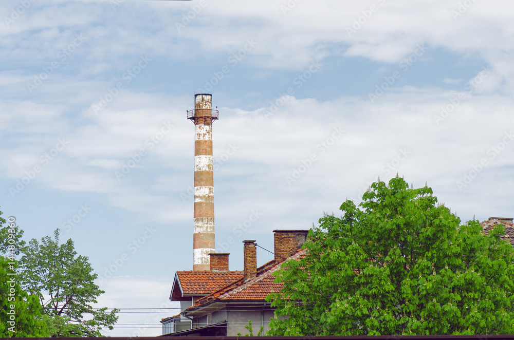 Old Tall Factory Chimney Pollute Above Small Town