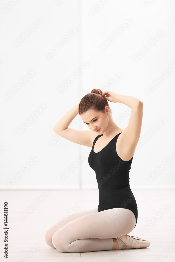 Ballet art concept. Young beautiful ballerina training in dance hall Ballet art concept. Young beautiful ballerina training in dance hall