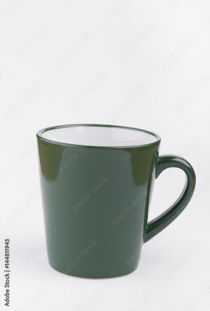Obraz premium Green cup isolated on white background