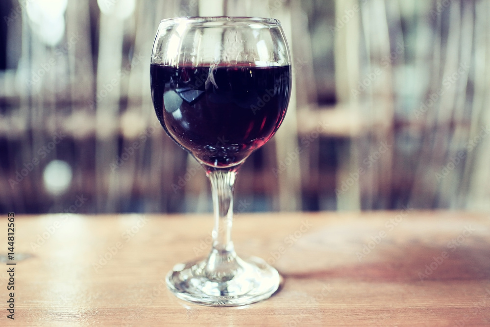 Serving a glass of red wine in a restaurant Serving a glass of red wine in a restaurant