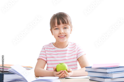 Happy schoolgirl studying a...