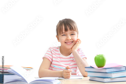 Happy schoolgirl studying a...