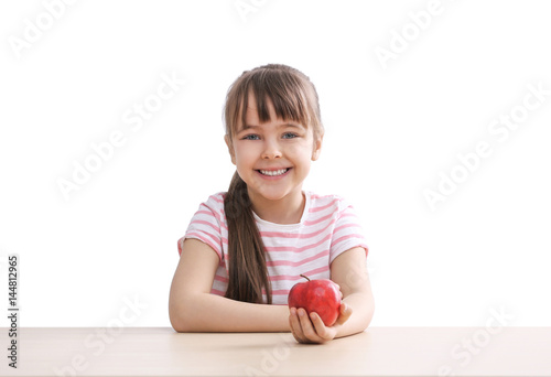 Happy schoolgirl sitting wi...