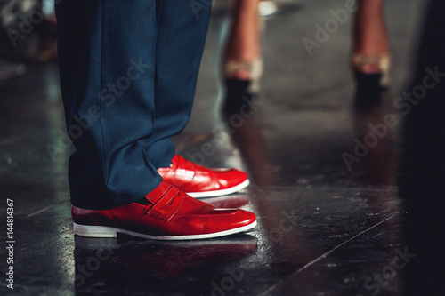 Men feet in classical pants and trendy red shoes © Mykola
