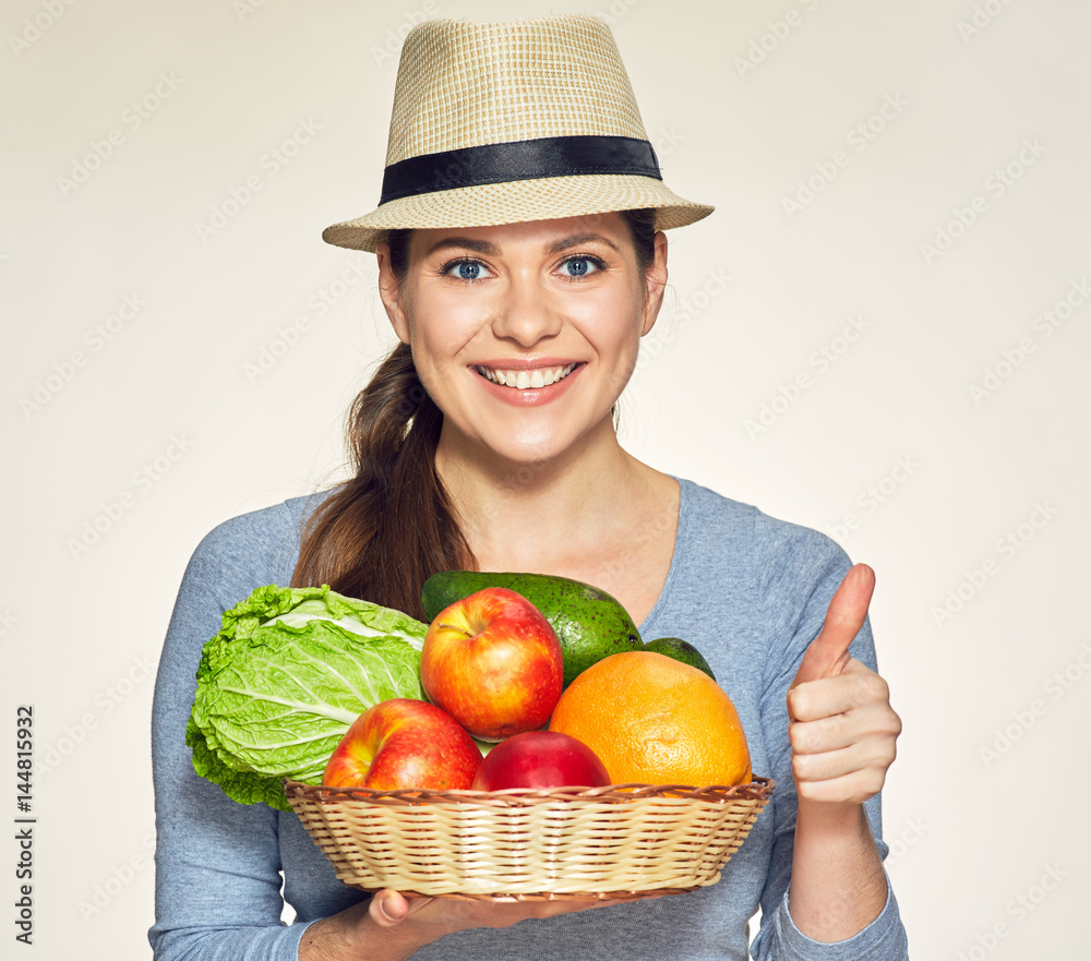 Vegetarian lifestyle portrait of young woman wearing modern hat. Vegetarian lifestyle portrait of young woman wearing modern hat.