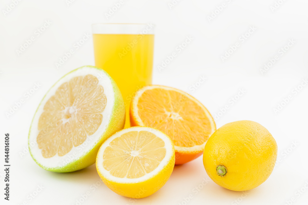 Natural juice of lemon, orange, mandarin, and sweetie on white background. Flat lay, top view. Fruit background Natural juice of lemon, orange, mandarin, and sweetie on white background. Flat lay, top view. Fruit background