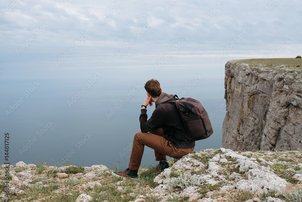 Man on top of mountain watch to the sea