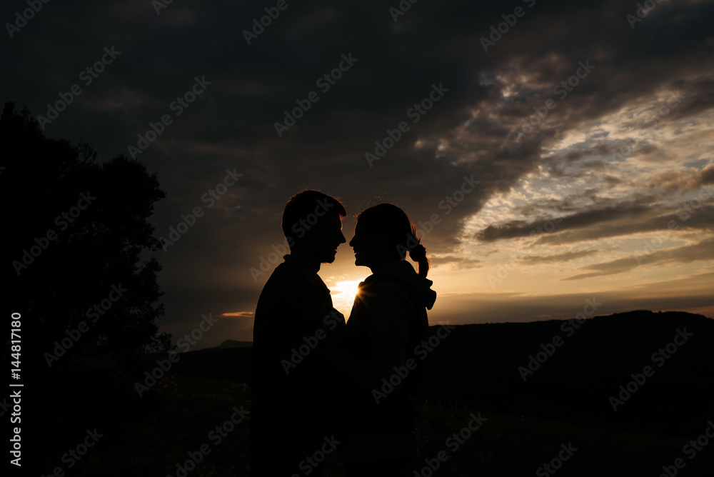Love couple on sunset at nature