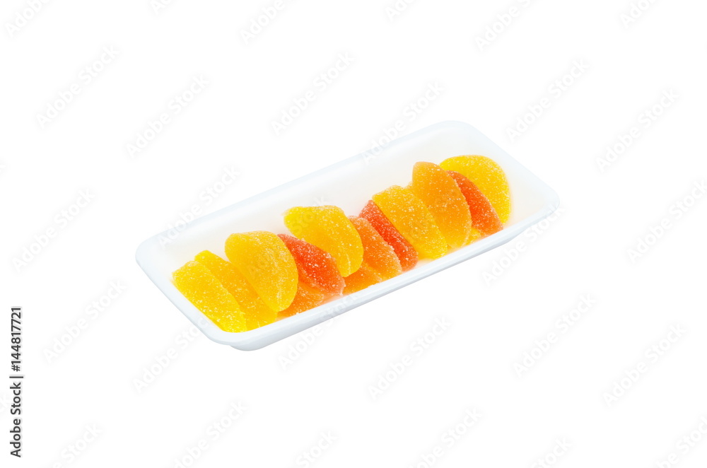 Bright multicolored marmalade on a tray, isolated on a white background Bright multicolored marmalade on a tray, isolated on a white background
