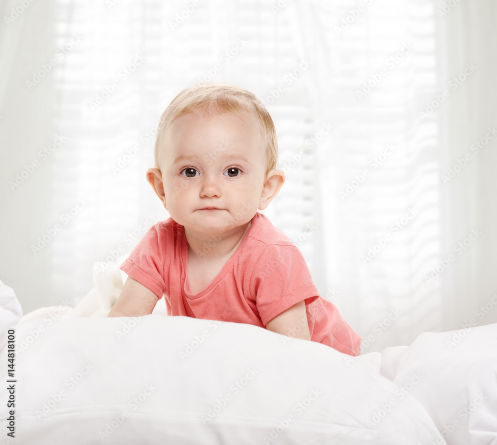 Happy baby child in bed Happy baby child in bed