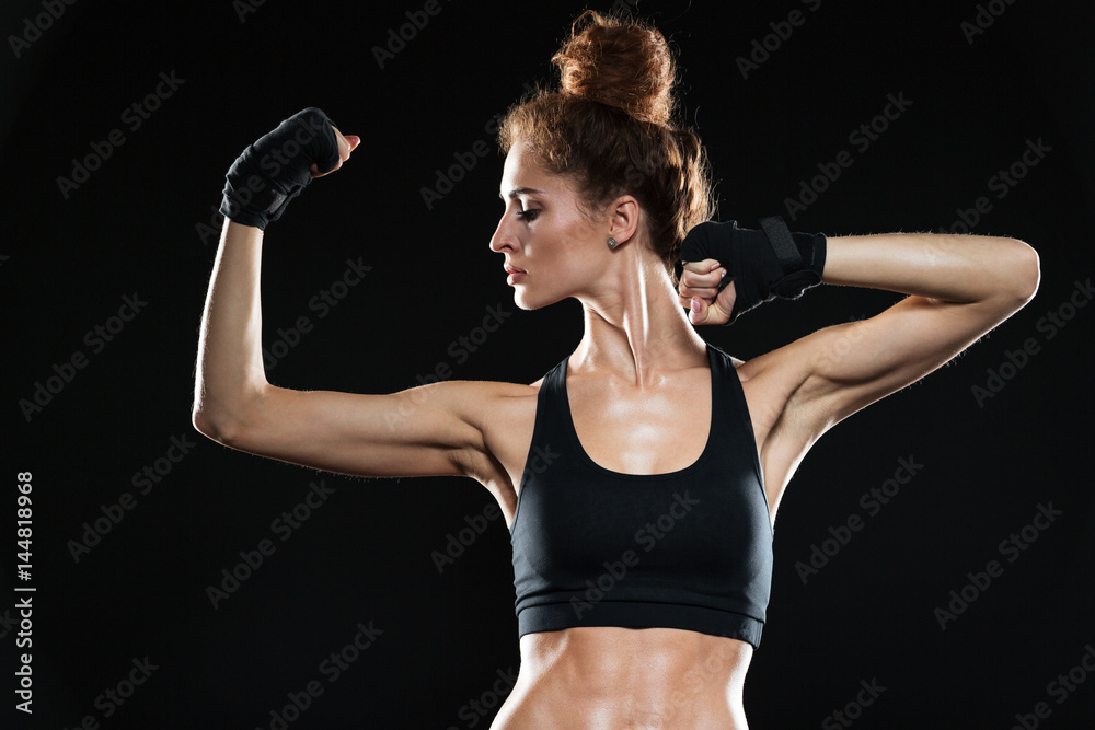 Serious female fighter showing her biceps Serious female fighter showing her biceps