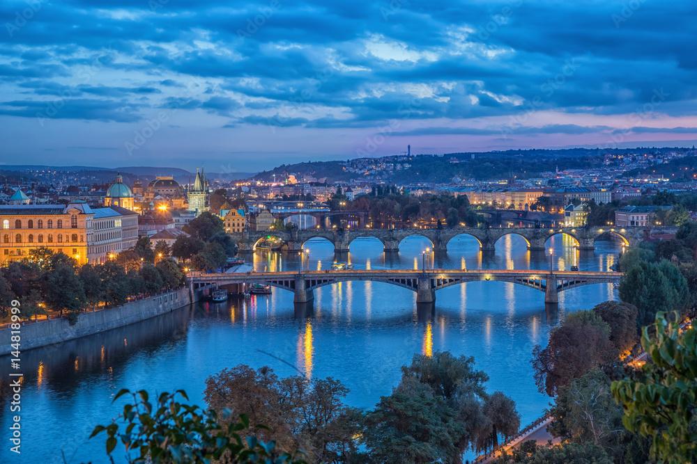 View on bridges across Vltava river at dusk from Letenske sady in Parague, Czech republic