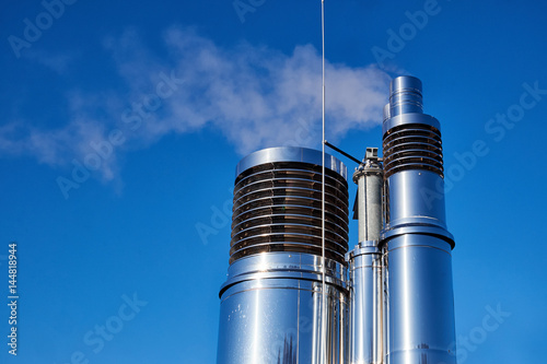 Obraz na plátně Round ventilation chimneys of polished stainless steel with slats sending out va