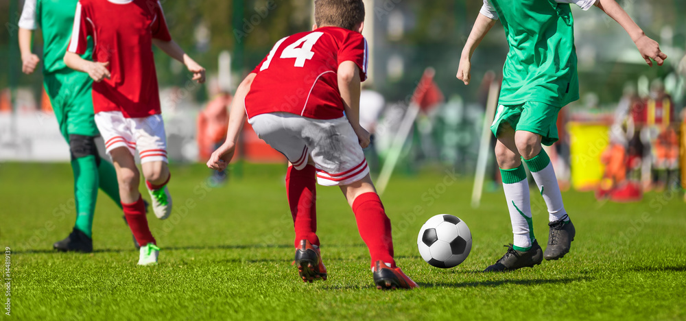 Football Soccer Match for Kids. Young Football Athletes. Coaching Youth Soccer. Children Playing Soccer Game Tournament. Boys Running and Kicking Football. Youth Soccer Coach in the Background Football Soccer Match for Kids. Young Football Athletes. Coaching Youth Soccer. Children Playing Soccer Game Tournament. Boys Running and Kicking Football. Youth Soccer Coach in the Background