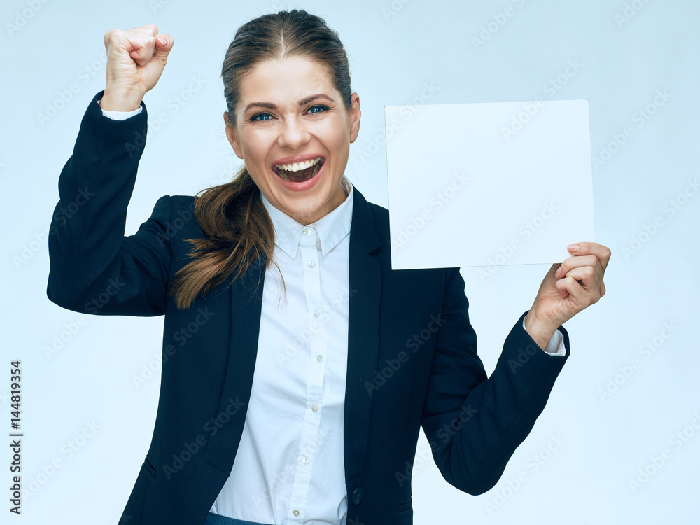 Happy business woman holding white advertising banner.
