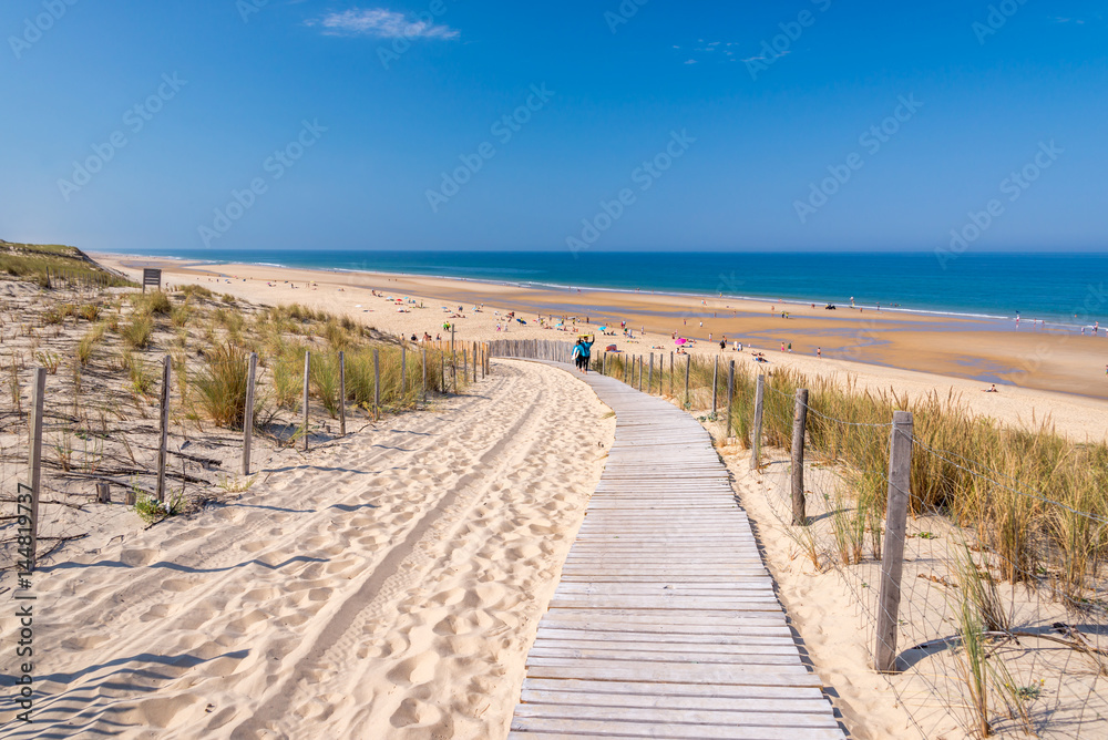 Wooden path in the sand dune and the beach of Lacanau, atlantic ocean, France