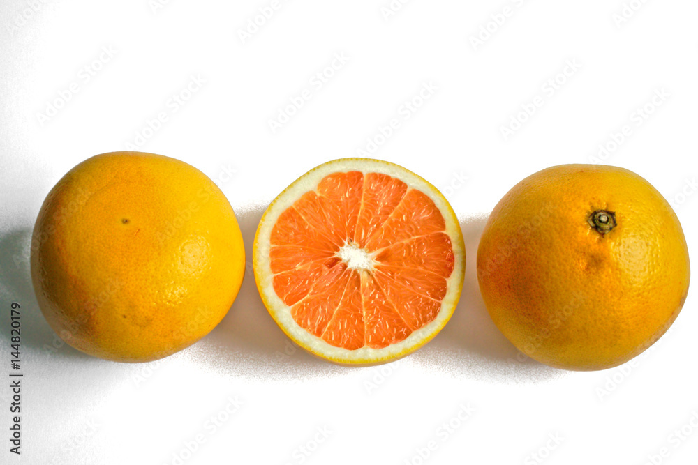 Closeup of yellow grapefruits on a white background Closeup of yellow grapefruits on a white background