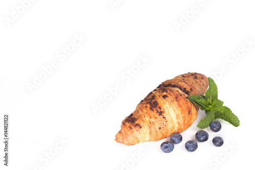 croissant with blueberries isolated on white